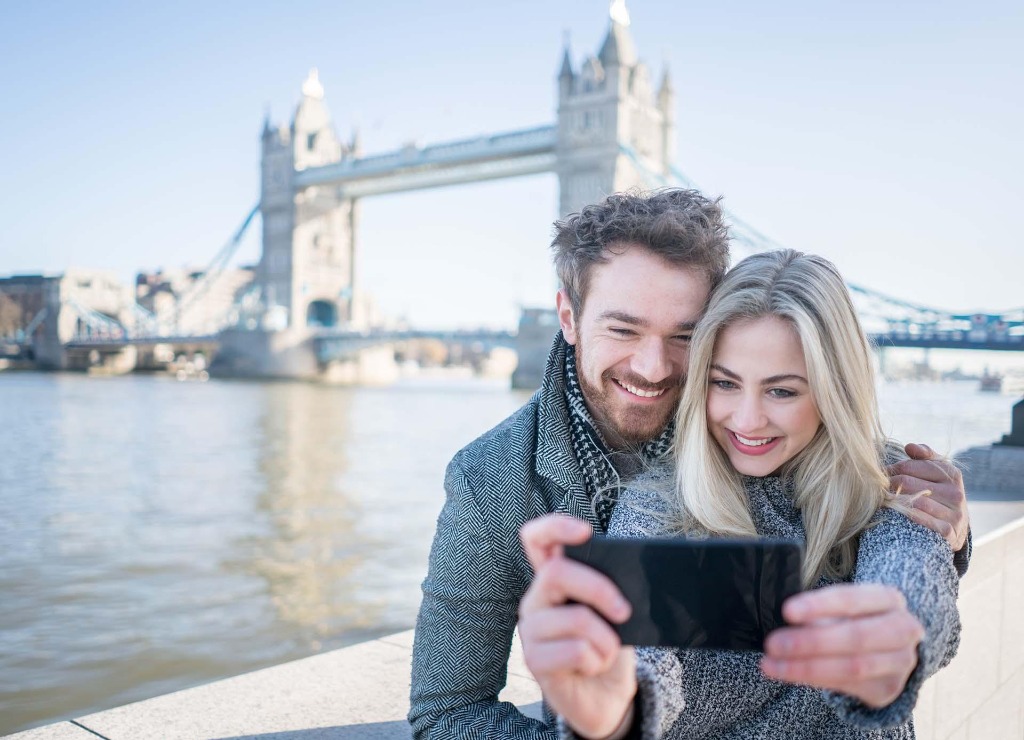 Couple laughing by the river